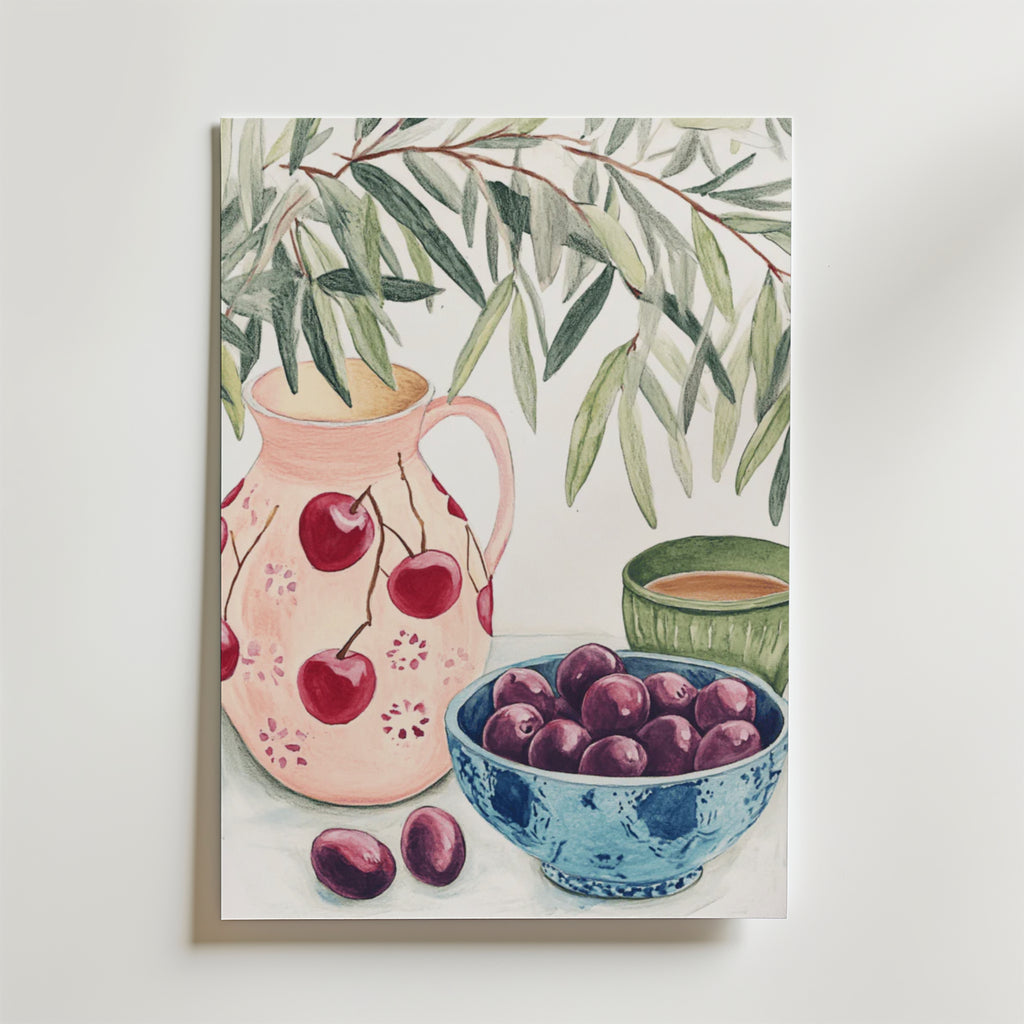 Postern Cherry And Olive Poster från Bozetto föreställer en akvarell av en rosa kanna med körsbär, en blå skål med plommon, en grön kopp och olivgrenar på vitt, tryckt på exklusivt premiumpapper för långvarig skönhet.