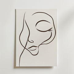 Dreamy Line Art Face Poster" av Bozetto föreställer ett lugnt ansikte med slutna ögon och böjda läppar, tecknat med minimalistiska svarta linjer på vit canvas för en elegant, abstrakt look.