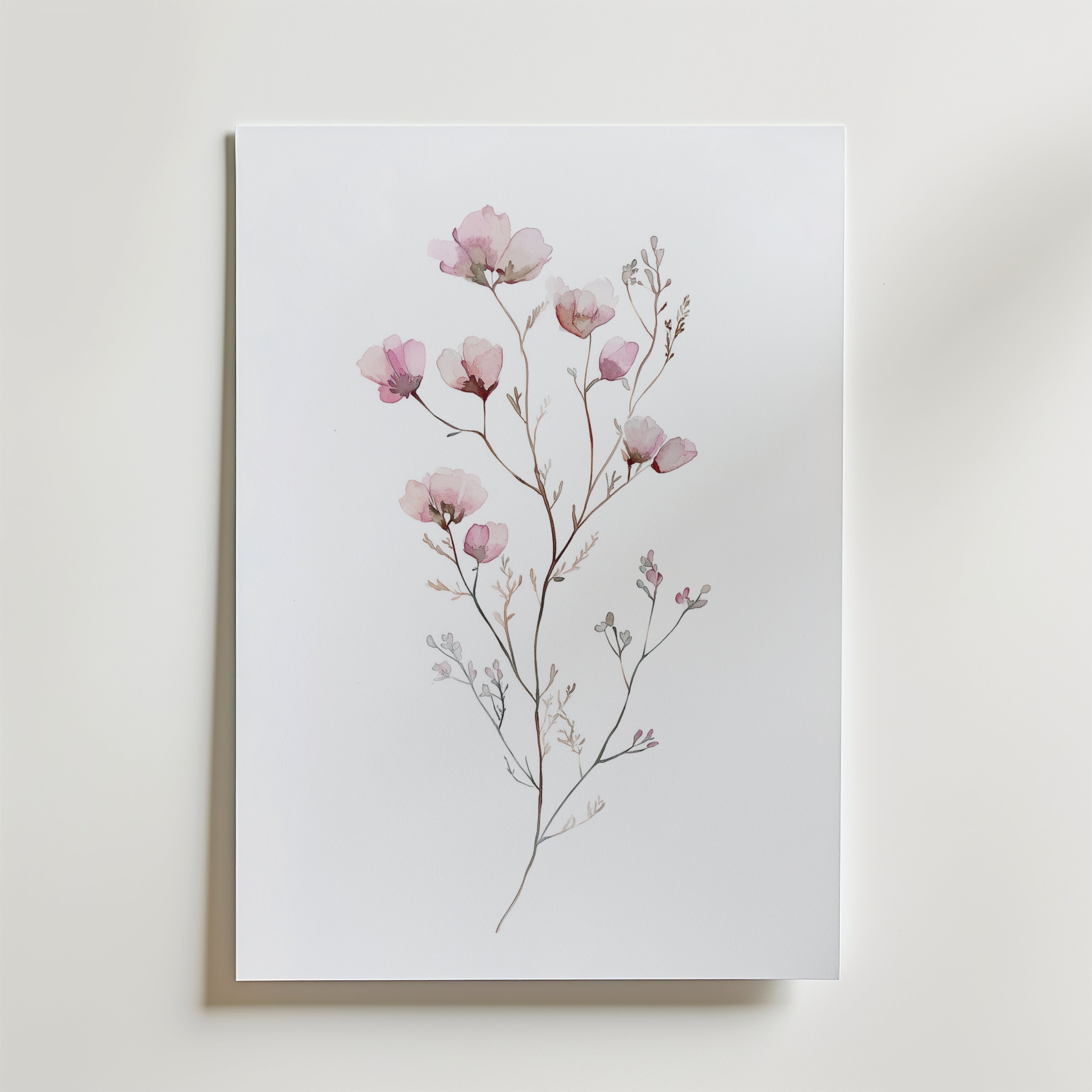 Bozetto White Rose Elegance No.2 Poster föreställer fina rosa blommor med tunna stjälkar och små blad på en vit bakgrund, tryckt på matt premiumpapper och placerad mot en vit yta.