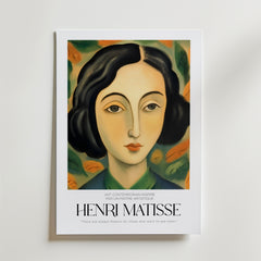 Quiet Wonder Matisse Poster från Bozetto föreställer en stiliserad kvinna med mörkt hår bland abstrakta blad, samt texten "Henri Matisse" och citatet: "Det finns alltid blommor för dem som vill se dem.